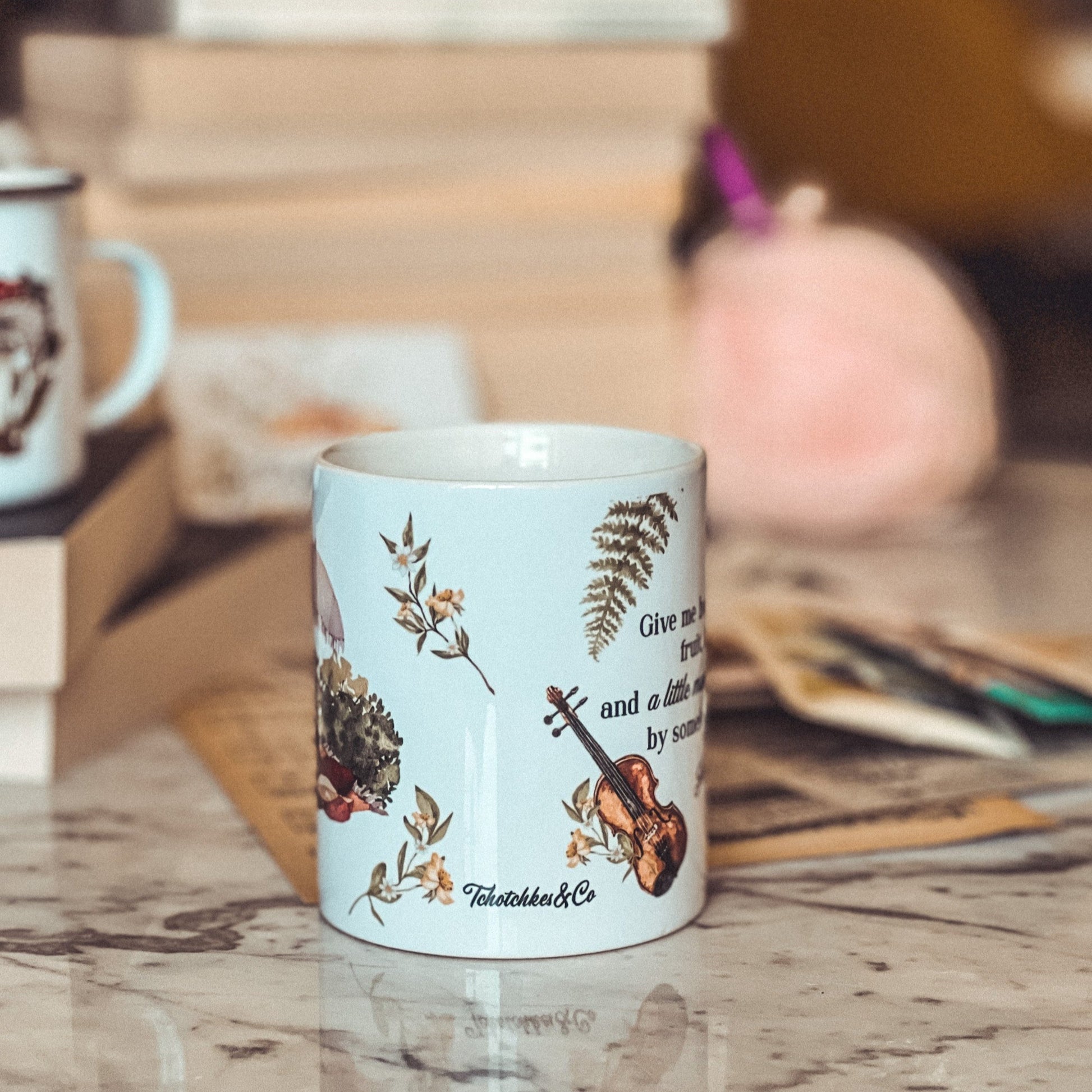 Bookish mug with flowers and a violin. 